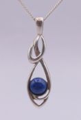 A limited edition 'Rennie Mackintosh' silver and lapis lazuli pendant on a silver chain,