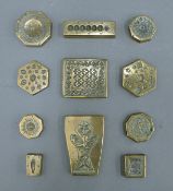 A quantity of Eastern antique bronze stamps. The largest 7 cm high.