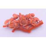 A Victorian coral flower brooch. 6.5 x 3 cm.