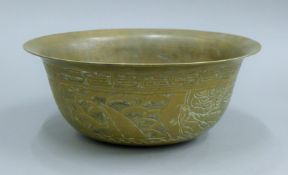 A 19th century Chinese brass bowl. 26 cm diameter.