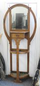 An Arts and Crafts oak hall stand. 195 cm high x 85 cm wide.