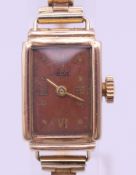 An Avia ladies' 9 ct gold cased ladies' wristwatch on a rolled gold bracelet. 1.