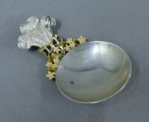 A Stuart Devlin silver, silver gilt and enamel caddy spoon,