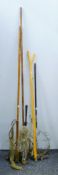 Four folding trout nets and a wooden wading stick.