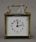 A cased Harrods carriage clock. The case 100.5 cm high.