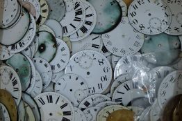 A quantity of pocket watch dials of various sizes. The largest 6 cm diameter.