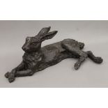A bronze model of a recumbent hare. 65 cm long.