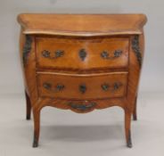 An early 20th century French bronze-mounted two-drawer bombe commode. 90 cm wide.