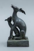 A bronze double deer seal. 12 cm high.
