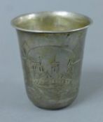 A Russian silver beaker decorated with townscape vignettes. 7.5 cm high. 62.4 grammes.