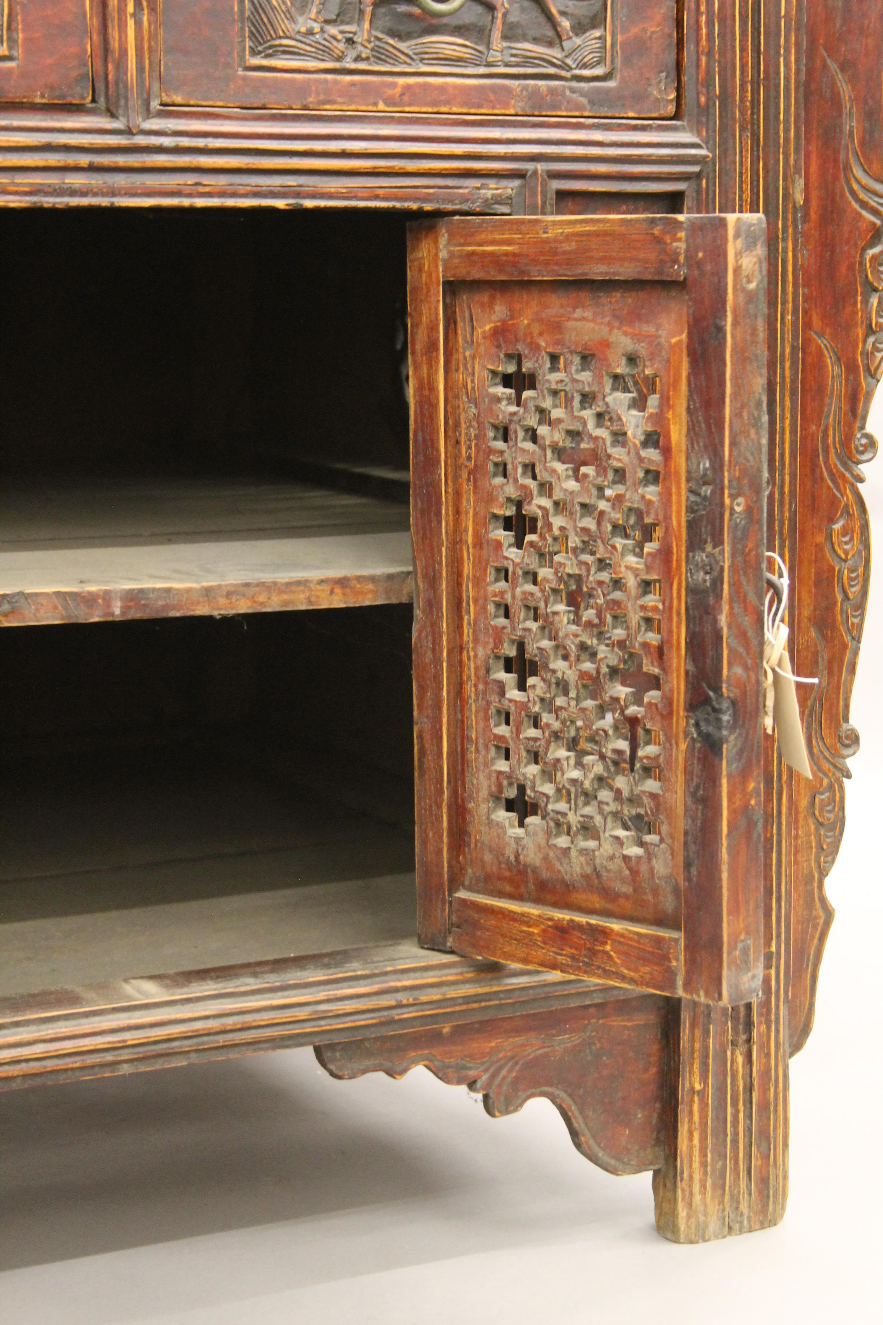 A 19th century Chinese elm side cupboard. 111 cm wide x 85 cm high x 79 cm deep. - Image 7 of 8