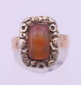 A Victorian 12 ct gold and carnelian ring. Ring size O. 4.2 grammes total weight.