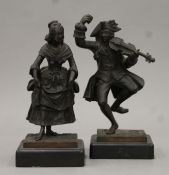 A pair of 19th century bronze figures of a dancing man with a violin and a dancing young maiden,