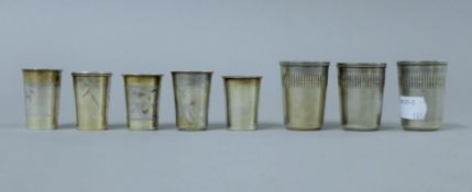 A quantity of Russian silver tot cups. The largest 5 cm high. 153 grammes.