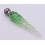 A silver-topped cut glass green scent bottle. 15 cm high.