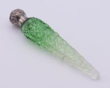 A silver-topped cut glass green scent bottle. 15 cm high.