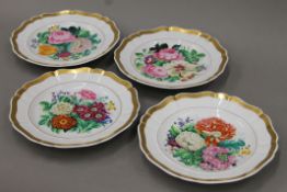 A set of four 19th century French florally-painted plates. Each 25 cm diameter.