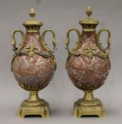 A pair of bronze-mounted marble cassolettes. Each 47 cm high.