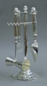 A silver-plated bar tool set. 29 cm high.