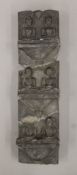 An antique Eastern stone stele fragment carved with seated Buddhas. 41 cm high.