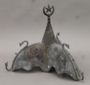 A 19th century Turkish pierced metal lamp shade, the finial mounted with star in a crescent moon.
