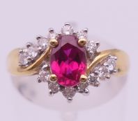 An 18 ct gold, diamond (0.25 carat) and ruby ring. Ring size L/M. 3.6 grammes total weight.