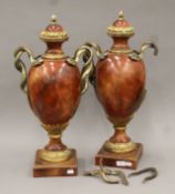 A pair of large resin cassolettes. Each 65 cm high.