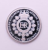 A 2022 Platinum Jubilee of Queen Elizabeth II platinum proof £5 coin together with certificate.