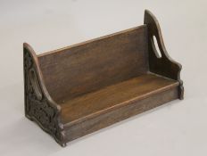 A Victorian oak book trough. 48 cm wide.