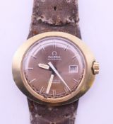 An Omega Dynamic ladies' wristwatch with an Omega buckle. 3 cm diameter including crown.