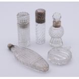 Five cut glass scent bottles including three silver-mounted (two unmarked). Largest 10.5 cm high.