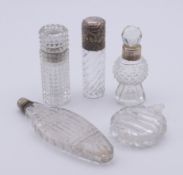 Five cut glass scent bottles including three silver-mounted (two unmarked). Largest 10.5 cm high.