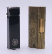 A Dunhill Cartier lighter and a Dunhill lighter. Each 6.5 cm high.