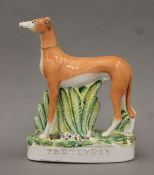 A Staffordshire pottery coursing greyhound 'Pretender'. 24.5 cm high.