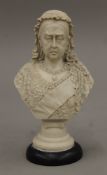 A resin bust of Queen Victoria. 19.5 cm high.