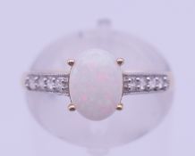 A 10 K gold, opal ring. Ring size L. 1.6 grammes total weight.