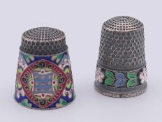 Two silver and enamel thimbles bearing Russian marks. 21 and 24 mm high.