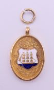 A 9 ct gold and enamel medal/pendant inscribed 'Guy Watts Cup Winners 1930-31'.