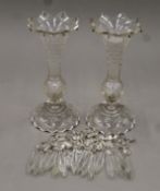 A pair of Victorian clear glass lustres. Each 24.5 cm high.