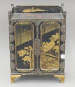 A late 19th century Japanese lacquered table cabinet. 43 cm high.