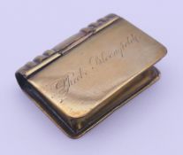 A brass book form snuff box, engraved to one side Phoebe Bloomfield. 4 cm high.