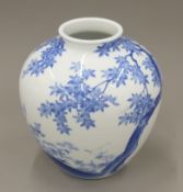 An early 20th century Japanese blue and white porcelain vase. 27 cm high.