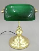 A banker's lamp with green glass shade. 25 cm wide.