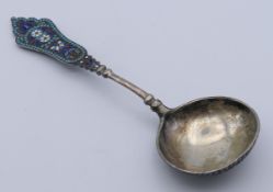 A Russian silver and enamel spoon. 18 cm long. 56.5 grammes total weight.