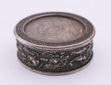 A Chinese coin box. 5 cm diameter.