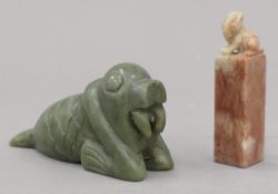 A Chinese green stone carving of a walrus and a soapstone seal. The former 10.5 cm high.