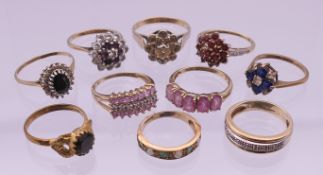 Ten various 9 ct gold rings. 24.2 grammes total weight. Various ring sizes.