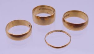 Four 22 ct gold wedding bands. 8mm, 6mm, 5mm and 2mm wide. Ring sizes J/K, O, L/M, L/M. 17.