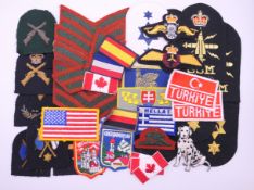 A quantity of Royal Navy cloth badges and other badges.