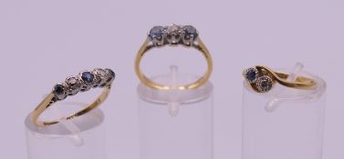 Three 18 ct gold and platinum rings. 7.4 grammes total weight. Ring sizes 2 x L 1 x P.